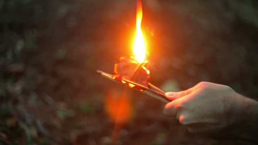 Survivalist starting a fire