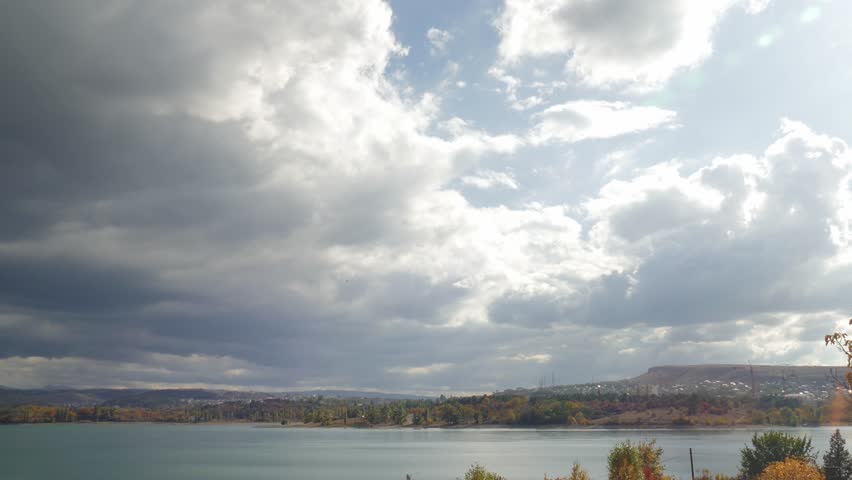 Autumn landscape with mountain lake / Stormy clouds over mountain lake 
