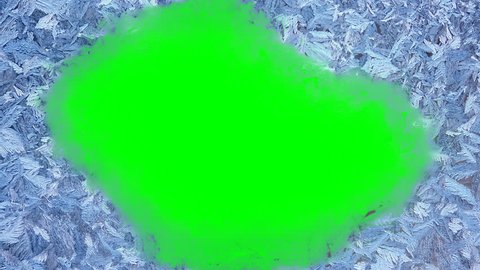 Beautiful frozen window melting animation from center to borders, timelapse defrost transition, natural dissolve, isolated on green chroma key background matte, alpha channel.