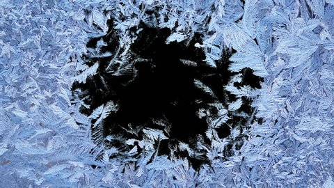 Beautiful window freezing animation from borders to center, timelapse frost forming transition, natural crystal icing, isolated on black background with black and white luminance matte, alpha channel.