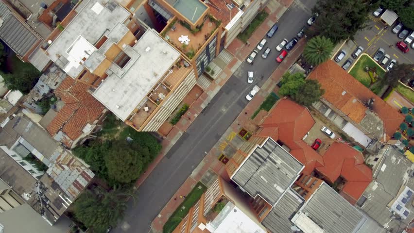 Aerial shot over buildings and roads in Bogota, Colombia