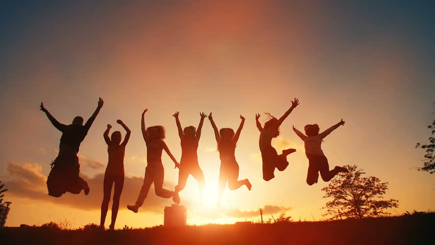 Cheerful People Jumping at Sunset Royalty-Free Stock Footage #31819969