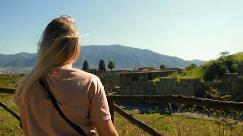 Pompeii, Italy Tourism. UNESCO World Heritage. Young Woman Exploring Europe. Vacation Travel Concept. Tourist Woman Exploring Pompeii Traveling In Italy. Italy's Famous Attractions. Vesuvius Volcano.