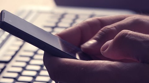 Sexting on mobile phone, man using smartphone app to send sexy texts and messages