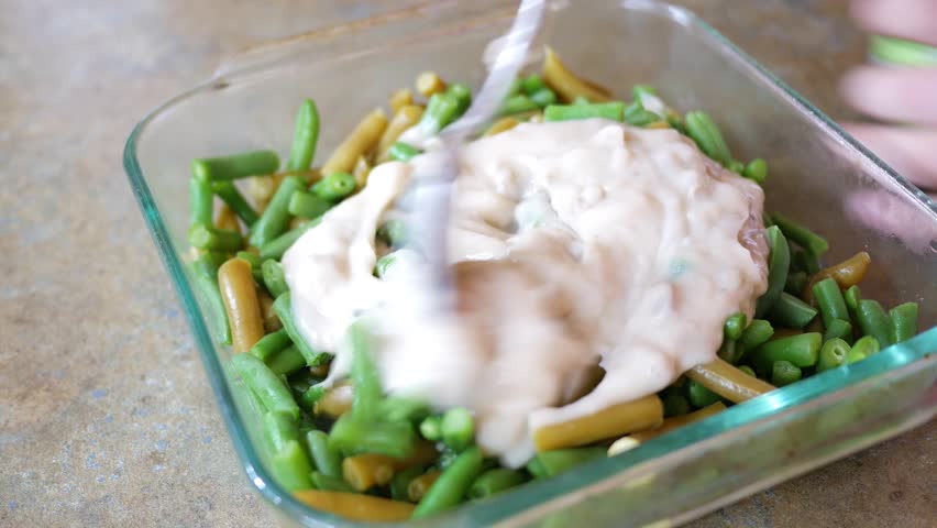 Mixing fat free mushroom soup in with green bean casserole