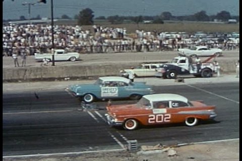 CIRCA 1950s - Various hot rods are driven, including a modified roadster, a Thunderbird, a Corvette and a Chevrolet, in the 5th Annual National Championship Drag Races, in Detroit, Michigan, in 1958.