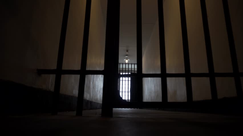 Prison Bars Open in a Dark, Depressing Looking Jail Cell. Royalty-Free Stock Footage #31850299