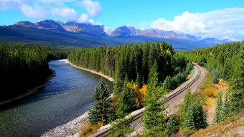 Canadian Pacific Railway freight train near Bow River at Morants Curveat in Banff National Park, Canada oldest national park and part of a UNESCO World Heritage Site.