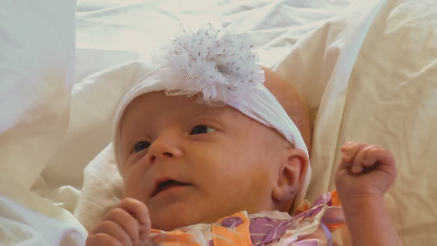 Portrait of a beautiful one month old infant girl