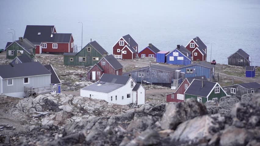 Greenland seaside arctic ocean ice floes global warming damage rising sea levels iceberg landscape geography nature travel freezing holidays glacial look rock small colorful village