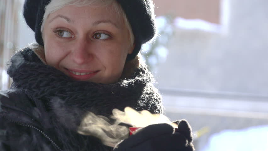 Sony FS-100 - Beautiful woman holding hot drink on a cold day outdoors! 