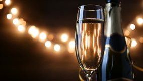 Toasting Champagne with holiday Bokeh Blinking Background. 4k footage