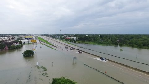 LEAGUE CITY, TEXAS - AUGUST 27th 2017 Cars and Trucks driving through flooded i45 during Hurricane Harvey