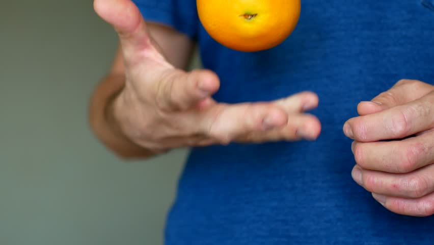 The man is allergic to citrus. He throws out the orange.