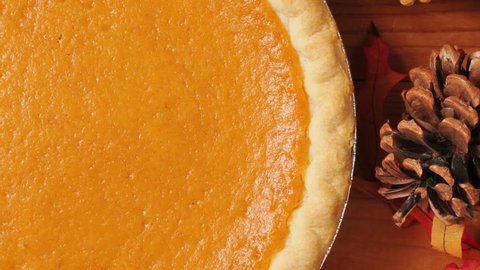 Zoom out shot of a sweet potato pie on an artistic set