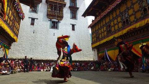 Tashichho Dzong, Thimphu, Bhutan - March 19, 2016: Thousands of local people and visitors witness mask dance festival in Thimphu.