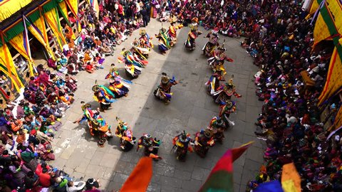 Tashichho Dzong, Thimphu, Bhutan - March 19, 2016: Thousands of local people and visitors witness mask dance festival in Thimphu. 