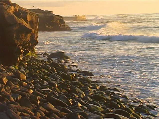 Orange misty Sunset at seashore in San Diego. 