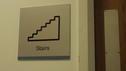 Stairs Sign with Person Walking Through