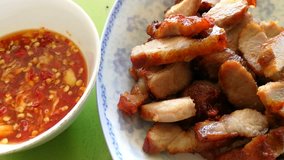 Fried Pork serve with Spicy Sauce, Traditional Asian and Laos Foods, Food Background 4k Video Footage Clip 