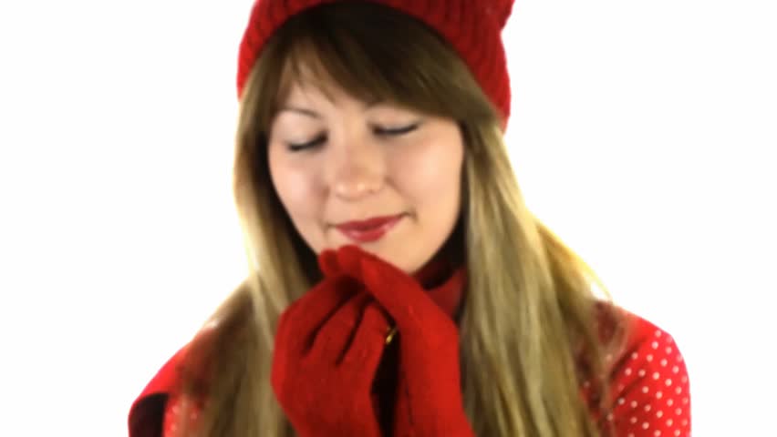 girl in red gloves presnts golden ball