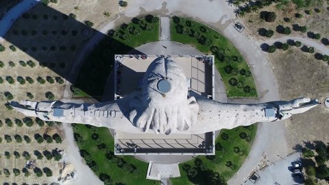 Aerial top-down footage of Sanctuary of Christ the King Portuguese Santuario de Cristo Rei is Catholic monument and shrine dedicated to Sacred Heart of Jesus Christ overlooking city of Lisbon Almada