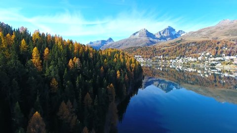 Autumnal landscape in Engadine, village of Sankt Moritz in Canton of Grisons. Aerial view over the forest