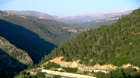 Chouf mountains. High-angle zoom-out to a view of a road snaking around the mountains in the Chouf district of Mount Lebanon.