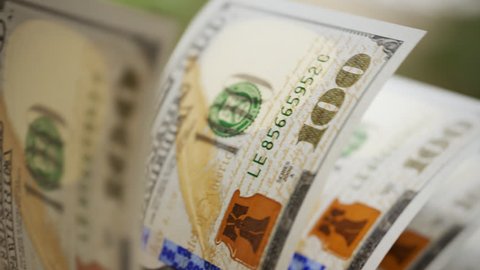 Close-up shot of counting 100 dolar bills