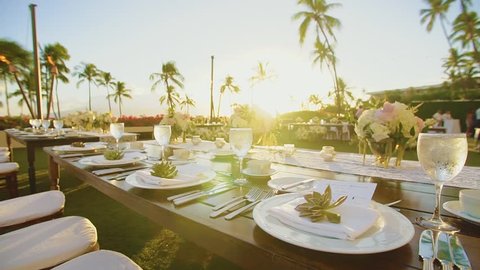 wedding tables with white utensils and glasses with shampagne on sunshines on resort hyatt,island maui,hawaii