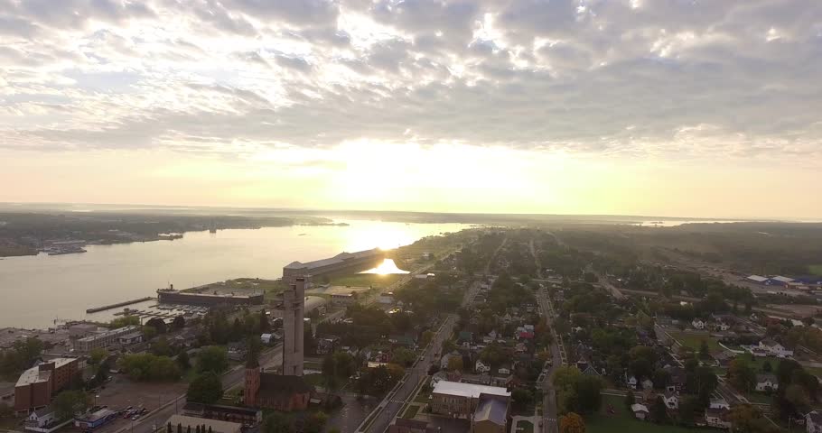 Aerial truck down over Sault Ste Marie, Michigan during sunset