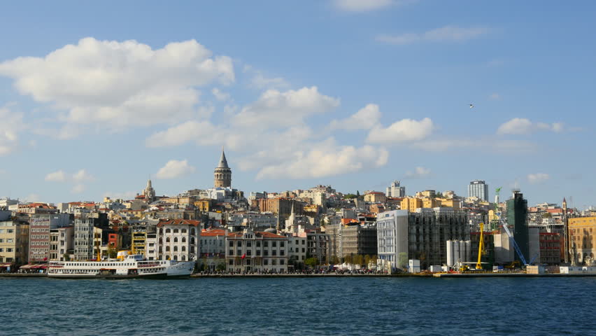 Panning Slow Motion of Istanbul Harbor in front of Galata Tower. City Sea Lines provide a welcome break from the bustle. Gyro stabilized panoramic shot from the waterside
 Royalty-Free Stock Footage #31955578