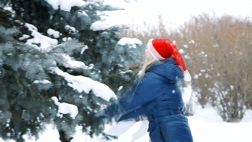 Happiys girl  walks in winter wood 