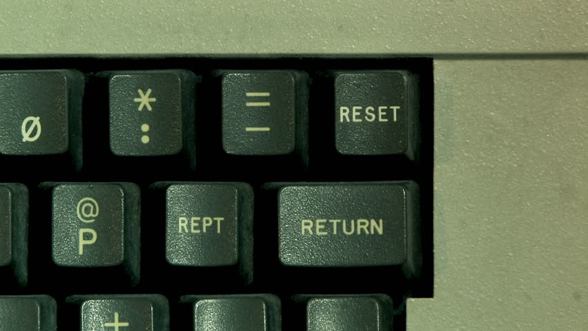 Hitting the RESET key on an old-style computer.