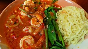 Spicy Shrimp Sauce, Green Vegetable and Yellow Noodles, Close Up Asia Traditional Thai Food, Stirring Seafood Noodle Asian Style, Food Background 4k Video Footage Clip