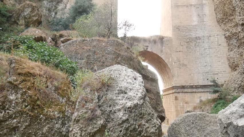 Ronda. The city is on the cliff. At the bottom of the abyss. View from the bottom of the abyss. The city is above the abyss. Video.