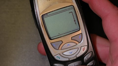 BUDAPEST, HUNGARY - OCTOBER 13, 2017: Classic game Snake II being played on a Nokia 6310i cellphone