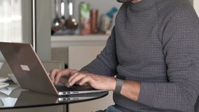 Young man finishing working on laptop and drinking coffee in kitchen at home
 - Powered by Shutterstock - Get 15% off with code: PIKWIZARD15