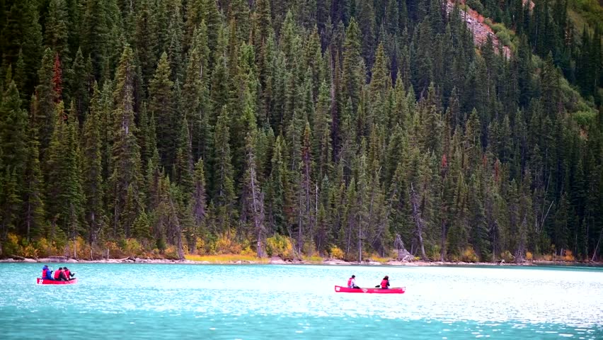 ALBERTA AB - SEPTEMBER 25,2017 :Canoe and tourists on vacation on Lake Louise in Banff National Park,Canada