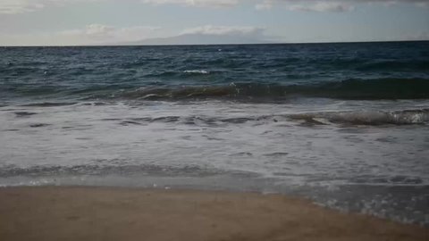 Waves on the sandy beach in Hawaii