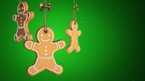 Animation of rotation on golden ropes christmas Gingerbread cookies on colorful background. Animation of seamless loop.