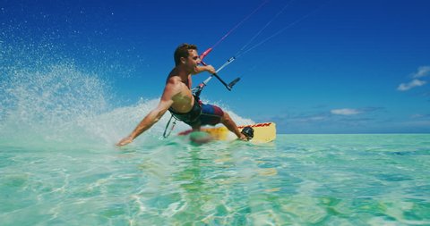 Kitesurfing on tropical island with amazing blue water