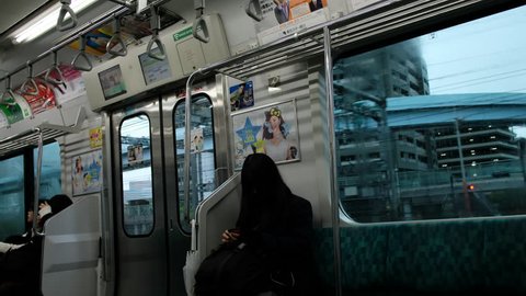 TOKYO, JAPAN - OCTOBER 21ST, 2017. 4k clips of Japanese school girl commuting in the train.