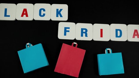 Phrase black friday with paper bags. Stop motion
