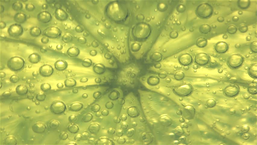 Sparkling bubbles water with a slice of lime Royalty-Free Stock Footage #31999924