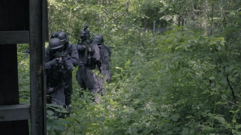 A Special Force Squad run in a wilderness area.