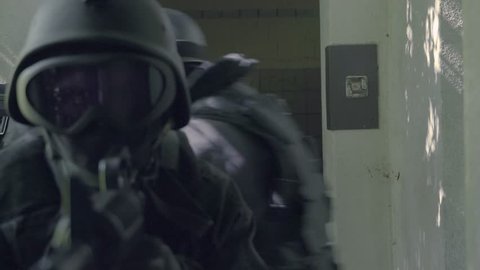 A Special Force Squad walk around a corner. Detail