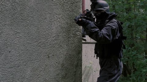Close Up Special Force Team enter a rustical house.