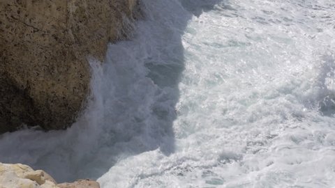 Slow motion shot of sea waves crushing the rocks with strong splashes. Waterscape of Rosh Hanikra