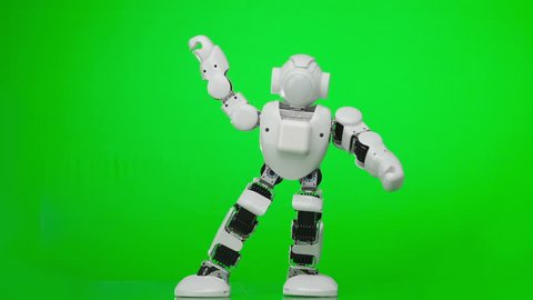 Humanoid robot dances a popular style dance. Green screen.
